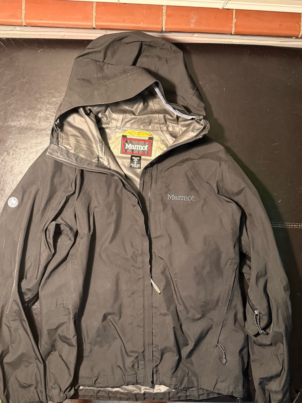 Marmot Black Hooded Rain Jacket with Yellow Logo Accents